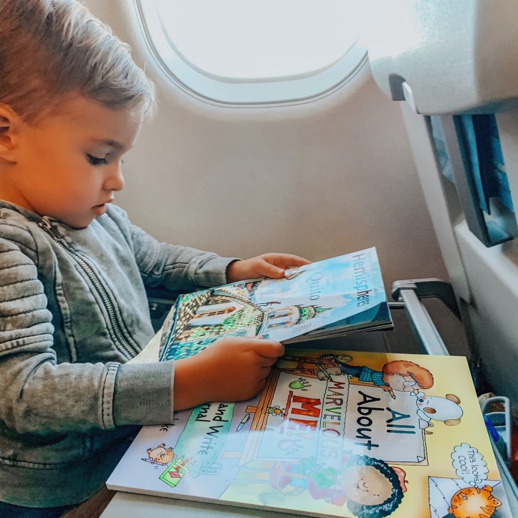 Boy reading on the plane